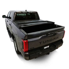 Load image into Gallery viewer, Rear side view of a Toyota Tundra with the Westin 19-20285 tonneau cover closed.