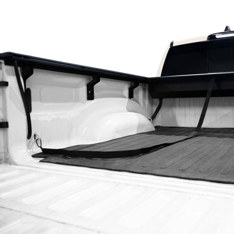 Rear angle view of a Westin retractable tonneau cover installed on a Ram 1500
