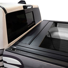 Load image into Gallery viewer, Westin retractable tonneau cover protecting cargo in a 2019-2026 Ram 1500 bed