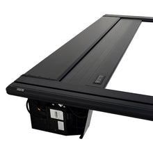 Load image into Gallery viewer, Westin Electric Retractable Tonneau Cover 19-26 Ram 1500 New Body 6.4ft Bed Black close-up view (6)