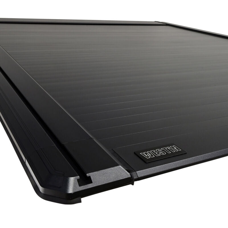 Westin Electric Retractable Tonneau Cover 19-26 Ram 1500 New Body 6.4ft Bed Black close-up view (7)