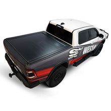Load image into Gallery viewer, Low-profile Westin WES19-64705 manual retractable tonneau cover for Ram 1500