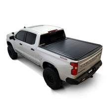 Load image into Gallery viewer, Side profile of the Westin manual retractable tonneau cover on a 2019-2026 Chevrolet Silverado 1500