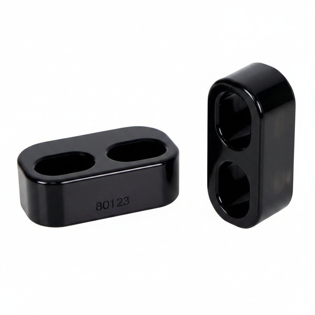Close-up of Whiteline door bushing for Mazda MX-5 Miata showing mounting holes