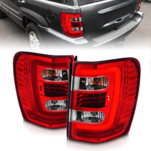 Load image into Gallery viewer, ANZO 1999-2004 Jeep Grand Cherokee LED Tail Lights w/ Light Bar Chrome Housing Red/Clear Lens-Tail Lights-ANZO