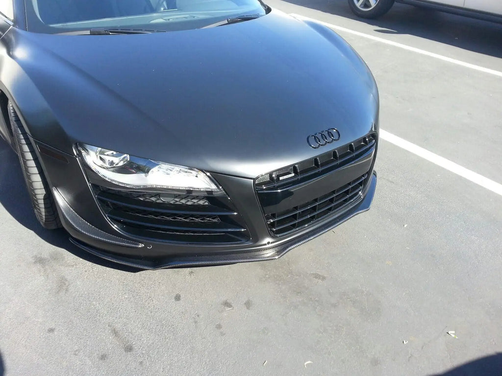 German Rush carbon fiber front splitter installed on the front bumper of a black 2007-2015 Audi R8