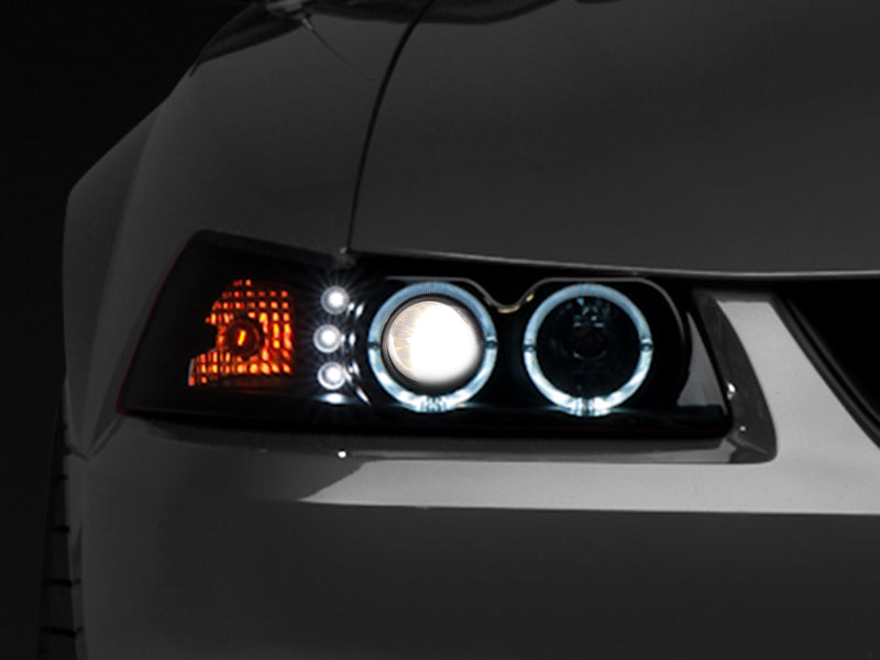 Raxiom 99-04 Ford Mustang Dual LED Halo Projector Headlights- Black Housing (Smoked Lens) - Raxiom 49113