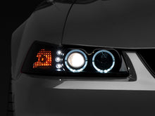 Load image into Gallery viewer, Raxiom 99-04 Ford Mustang Dual LED Halo Projector Headlights- Black Housing (Smoked Lens) - Raxiom 49113