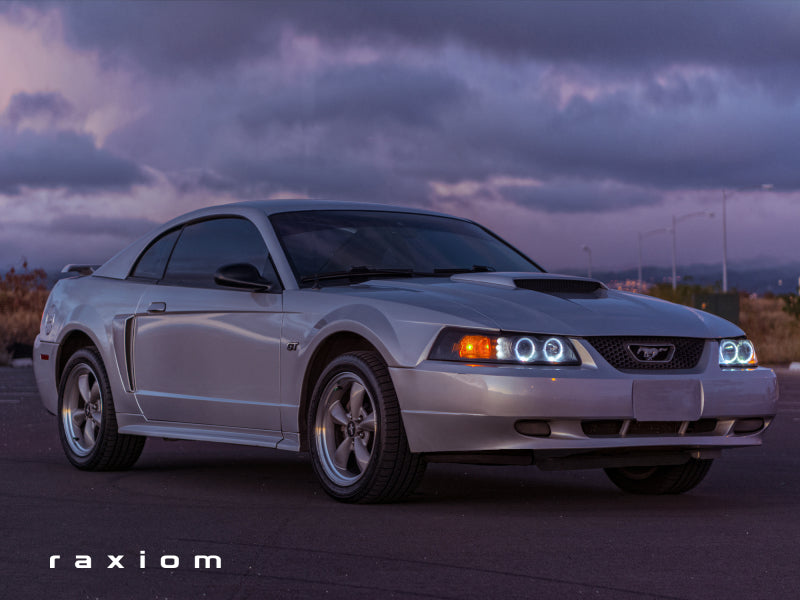 Raxiom 99-04 Ford Mustang Dual LED Halo Projector Headlights- Black Housing (Smoked Lens) - Raxiom 49113