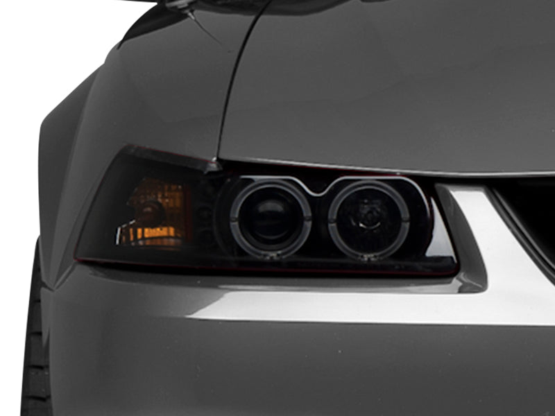 Raxiom 99-04 Ford Mustang Dual LED Halo Projector Headlights- Black Housing (Smoked Lens) - Raxiom 49113