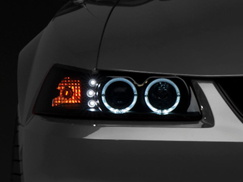 Raxiom 99-04 Ford Mustang Dual LED Halo Projector Headlights- Black Housing (Smoked Lens) - Raxiom 49113