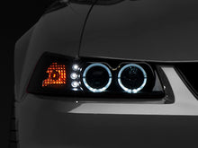 Load image into Gallery viewer, Raxiom 99-04 Ford Mustang Dual LED Halo Projector Headlights- Black Housing (Smoked Lens) - Raxiom 49113