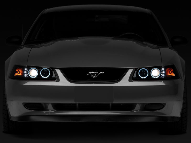 Raxiom 99-04 Ford Mustang Dual LED Halo Projector Headlights- Black Housing (Smoked Lens) - Raxiom 49113